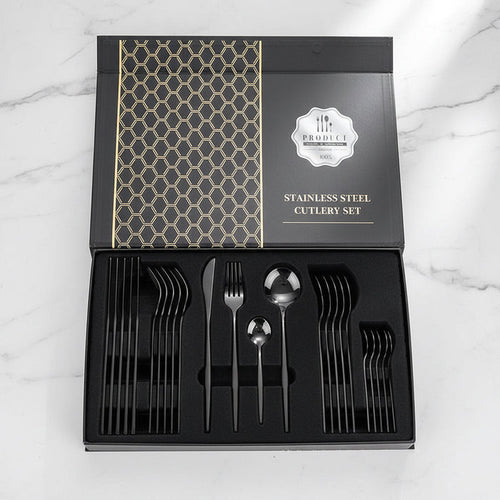 24-piece black stainless steel flatware set displayed in a gift box on countertop