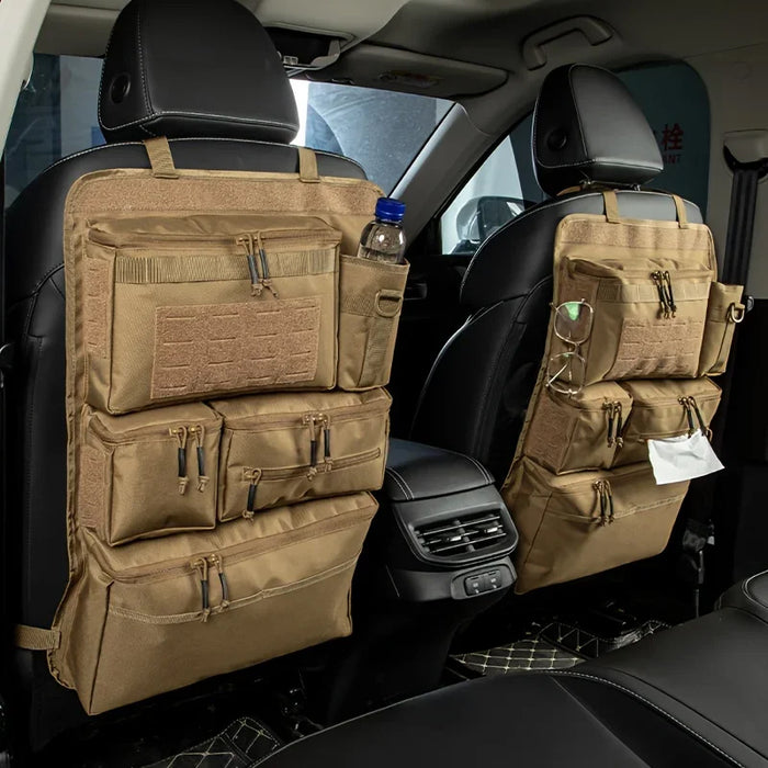 Khaki colored organizers on the back of the driver and passenger seats with a water bottle in the back of one and wipes in the other.